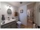 Bright bathroom with white cabinets, updated sink, and modern fixtures at 6432 Aberdeen Ln, Las Vegas, NV 89107
