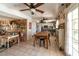 Bright dining area with tile floors and vintage decor, seamlessly connecting the living spaces at 6432 Aberdeen Ln, Las Vegas, NV 89107