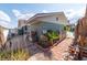 Side exterior showcasing well-maintained landscaping and access to the backyard amenities, blending charm and functionality at 6432 Aberdeen Ln, Las Vegas, NV 89107
