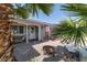 Inviting front yard with desert landscape, cozy seating and lots of character with an American flag at 6432 Aberdeen Ln, Las Vegas, NV 89107
