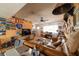 Bright living room with eclectic decor, vintage details, and comfortable seating arrangement at 6432 Aberdeen Ln, Las Vegas, NV 89107