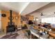 Inviting living room with wood-burning stove, vintage decor, wood floors, and comfortable seating at 6432 Aberdeen Ln, Las Vegas, NV 89107