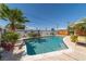 Enjoy the spacious pool area with ample greenery, creating a serene and private backyard oasis at 6432 Aberdeen Ln, Las Vegas, NV 89107