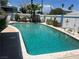 Refreshing backyard swimming pool with clear turquoise water and decorative fence at 6432 Aberdeen Ln, Las Vegas, NV 89107