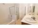 Bathroom featuring vanity with double sinks, tub, shower and white tiled wall at 6516 Velvet Silk St, North Las Vegas, NV 89084