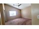 Bedroom featuring carpet, ceiling fan, window, and neutral colored walls at 6516 Velvet Silk St, North Las Vegas, NV 89084