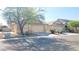 Single-story home with desert landscaping, and two car garage at 6516 Velvet Silk St, North Las Vegas, NV 89084