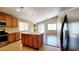 Modern kitchen featuring a center island, wood cabinetry, recessed lighting, and stainless steel appliances at 6516 Velvet Silk St, North Las Vegas, NV 89084