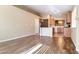 Open concept living and dining area with beautiful hardwood floors, recessed lighting, and plenty of natural light at 6516 Velvet Silk St, North Las Vegas, NV 89084