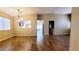 Open-concept living area with hardwood floors, recessed lighting, and views of the dining area and kitchen at 6516 Velvet Silk St, North Las Vegas, NV 89084