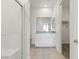 Bathroom featuring a shower, a vanity with a gray countertop, and a closet at 6737 Lotus Vista Ct, Las Vegas, NV 89156