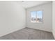 An airy bedroom featuring neutral carpet and a window with blinds at 6737 Lotus Vista Ct, Las Vegas, NV 89156