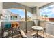 Comfortable balcony with outdoor seating, potted plants, and views of the neighborhood at 6955 N Durango Dr # 3013, Las Vegas, NV 89149