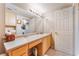 Bathroom featuring a sink, vanity, medicine cabinet, and linen closet at 6955 N Durango Dr # 3013, Las Vegas, NV 89149