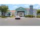 Front exterior of the apartment building featuring tidy landscaping and ample parking at 6955 N Durango Dr # 3013, Las Vegas, NV 89149