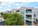 Exterior view of a multi-story apartment building with balconies and well-maintained landscaping at 6955 N Durango Dr # 3013, Las Vegas, NV 89149