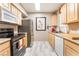 Efficient kitchen with stainless steel appliances and ample cabinet space at 6955 N Durango Dr # 3013, Las Vegas, NV 89149