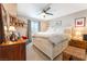 Inviting primary bedroom with a ceiling fan, a large bed, and ample natural light at 6955 N Durango Dr # 3013, Las Vegas, NV 89149