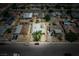 This aerial view shows the layout of the neighborhood with many single Gathering homes at 704 Kings Ave, North Las Vegas, NV 89030
