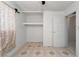 Bedroom includes built in shelving, tiled floor and white door at 704 Kings Ave, North Las Vegas, NV 89030