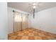 Bedroom featuring a ceiling fan and a large window with patterned curtains at 704 Kings Ave, North Las Vegas, NV 89030