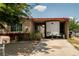 Exterior view of the property with a trailer in the carport at 704 Kings Ave, North Las Vegas, NV 89030