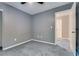 Neutral-toned bedroom featuring carpet and access to a hallway at 9112 Canoga Canyon Ct # 103, Las Vegas, NV 89149