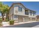 Charming townhome with a private balcony and attached garages in a well-maintained community at 9112 Canoga Canyon Ct # 103, Las Vegas, NV 89149