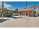 Community hot tub with nearby clubhouse and picnic tables for a relaxing experience at 9112 Canoga Canyon Ct # 103, Las Vegas, NV 89149