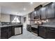 Charming kitchen equipped with stainless steel appliances, modern cabinetry, and granite countertops at 9112 Canoga Canyon Ct # 103, Las Vegas, NV 89149