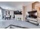 Open-concept living area with tile flooring, view of the kitchen, and plenty of natural light at 9112 Canoga Canyon Ct # 103, Las Vegas, NV 89149