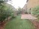 This is a backyard that features rock landscaping and artificial turf. There is a small patio in the corner at 10537 Thor Mountain Ln, Las Vegas, NV 89166