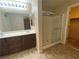 Well-appointed bathroom featuring double sinks and a glass-enclosed shower for convenience at 10537 Thor Mountain Ln, Las Vegas, NV 89166