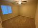 Comfortable bedroom features a ceiling fan and a bright window with white blinds at 10537 Thor Mountain Ln, Las Vegas, NV 89166