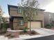 Charming two-story home featuring a neutral color scheme, a two-car garage and well-manicured landscaping at 10537 Thor Mountain Ln, Las Vegas, NV 89166