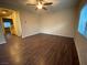 This spacious living room features wood floors and a ceiling fan and has plenty of natural light at 10537 Thor Mountain Ln, Las Vegas, NV 89166