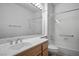 Clean bathroom featuring single sink vanity, large mirror and shower-tub combination at 10646 Heritage Hills Dr, Las Vegas, NV 89134