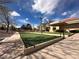 Open-air bocce ball court with a covered seating area, perfect for outdoor recreation at 10646 Heritage Hills Dr, Las Vegas, NV 89134