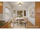 Cozy breakfast nook featuring a round dining table, charming bay window, and warm natural light at 10646 Heritage Hills Dr, Las Vegas, NV 89134