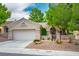 Charming single-story home with a well-maintained desert landscape and a spacious two-car garage at 10646 Heritage Hills Dr, Las Vegas, NV 89134