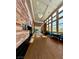 Bright and inviting lobby featuring a stone accent wall, sleek wood floors, and comfortable seating areas at 10646 Heritage Hills Dr, Las Vegas, NV 89134