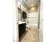 Bathroom with a shower-tub combo featuring tile flooring, vanity with sink, and a mirror at 10719 Hammett Park Ave, Las Vegas, NV 89166