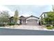 Charming single-story home with a brick driveway and a two-car garage at 10719 Hammett Park Ave, Las Vegas, NV 89166