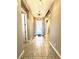 Well lit hallway features ceramic tiles at 10719 Hammett Park Ave, Las Vegas, NV 89166