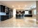 Modern kitchen featuring stainless steel appliances, a large island, and plenty of cabinet space at 10719 Hammett Park Ave, Las Vegas, NV 89166