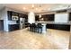 Stylish open kitchen with modern cabinetry, stainless steel appliances, and large island at 10719 Hammett Park Ave, Las Vegas, NV 89166