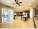 Bright open kitchen with granite counters, stainless appliances, and views of the backyard at 10719 Hammett Park Ave, Las Vegas, NV 89166