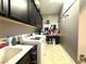 Laundry room featuring a washer and dryer, countertop, and built-in storage at 10719 Hammett Park Ave, Las Vegas, NV 89166