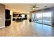 Open concept living area leading to the kitchen and patio with a sliding glass door at 10719 Hammett Park Ave, Las Vegas, NV 89166