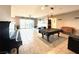 Spacious open floor plan with tile floors, large windows, and great room concept at 10719 Hammett Park Ave, Las Vegas, NV 89166